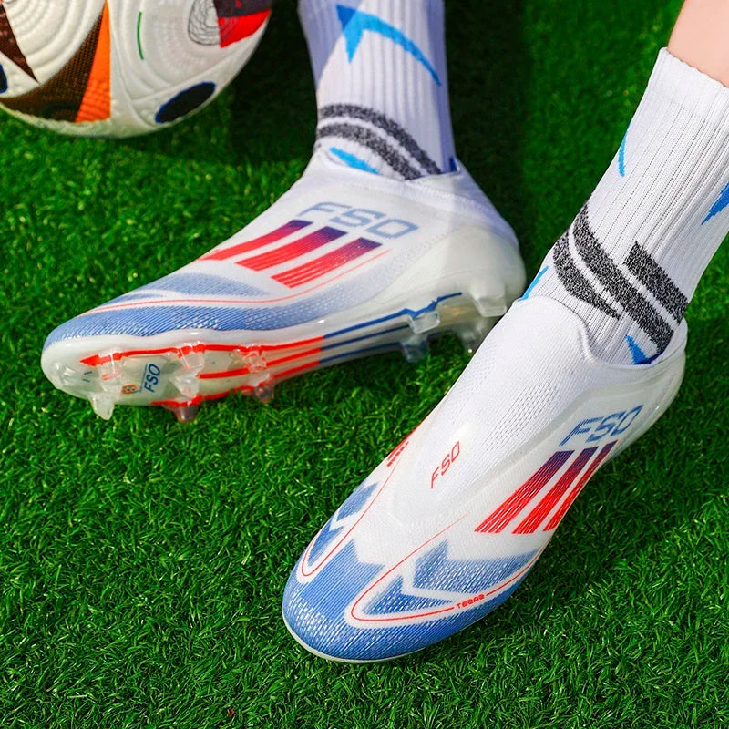 White soccer cleats with red and blue accents on a grass field